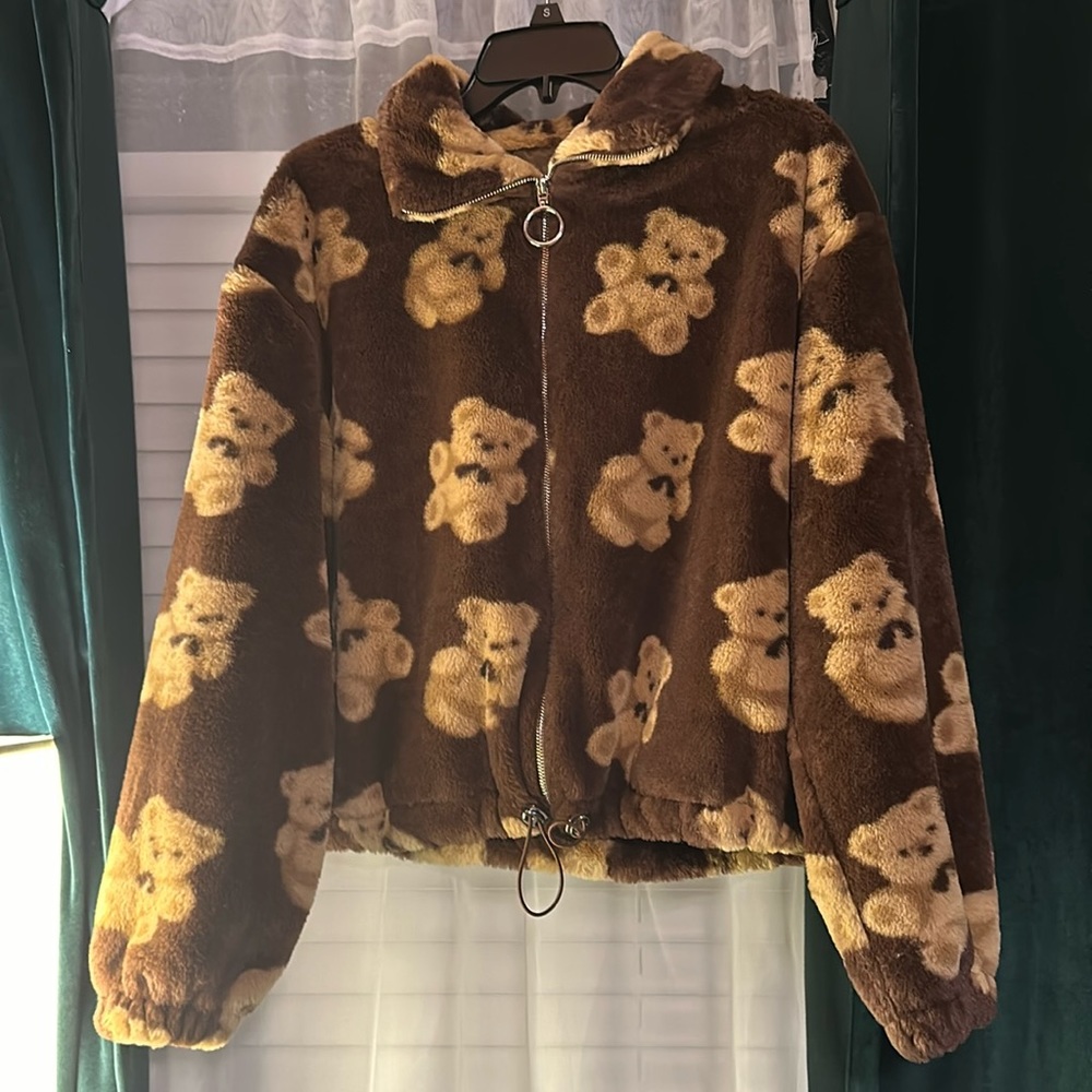 Medium, brown fuzzy cropped jacket with zipper.